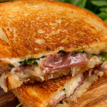 Grilled Cheese with Grand Cru, Fig Jam, Prosciutto and Arugula